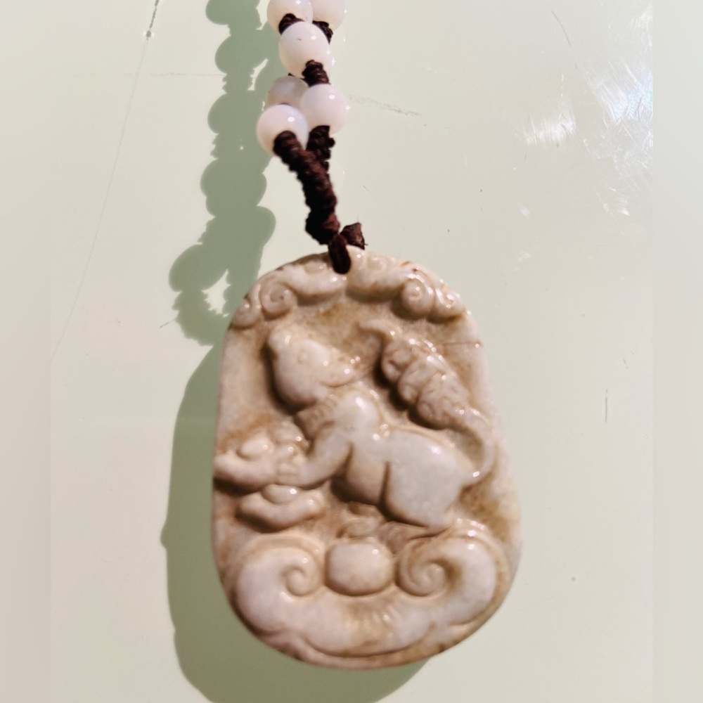 Jade carved pig necklace, pale green